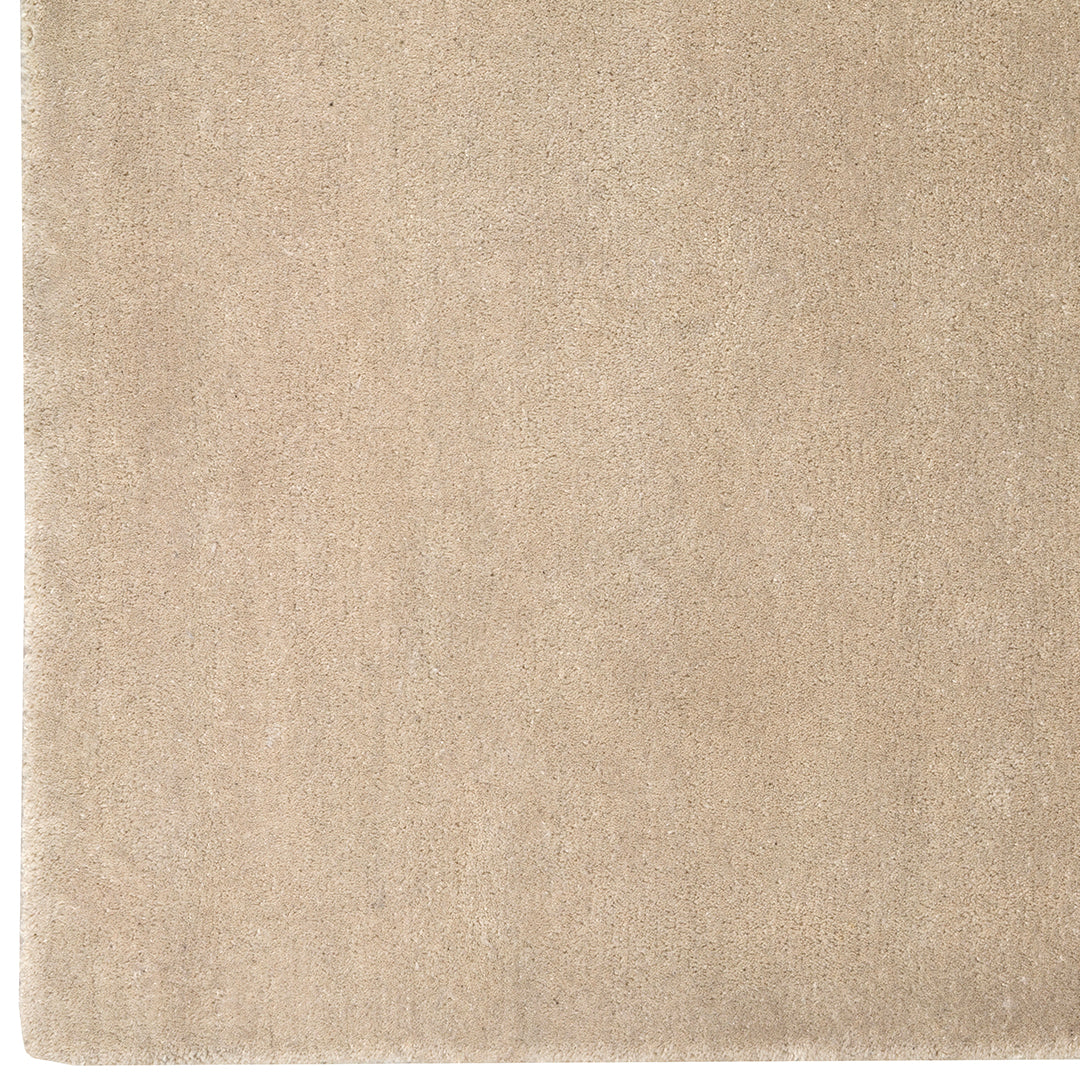 Beige textured surface with a smooth, subtle sheen for a minimalist, modern aesthetic. 