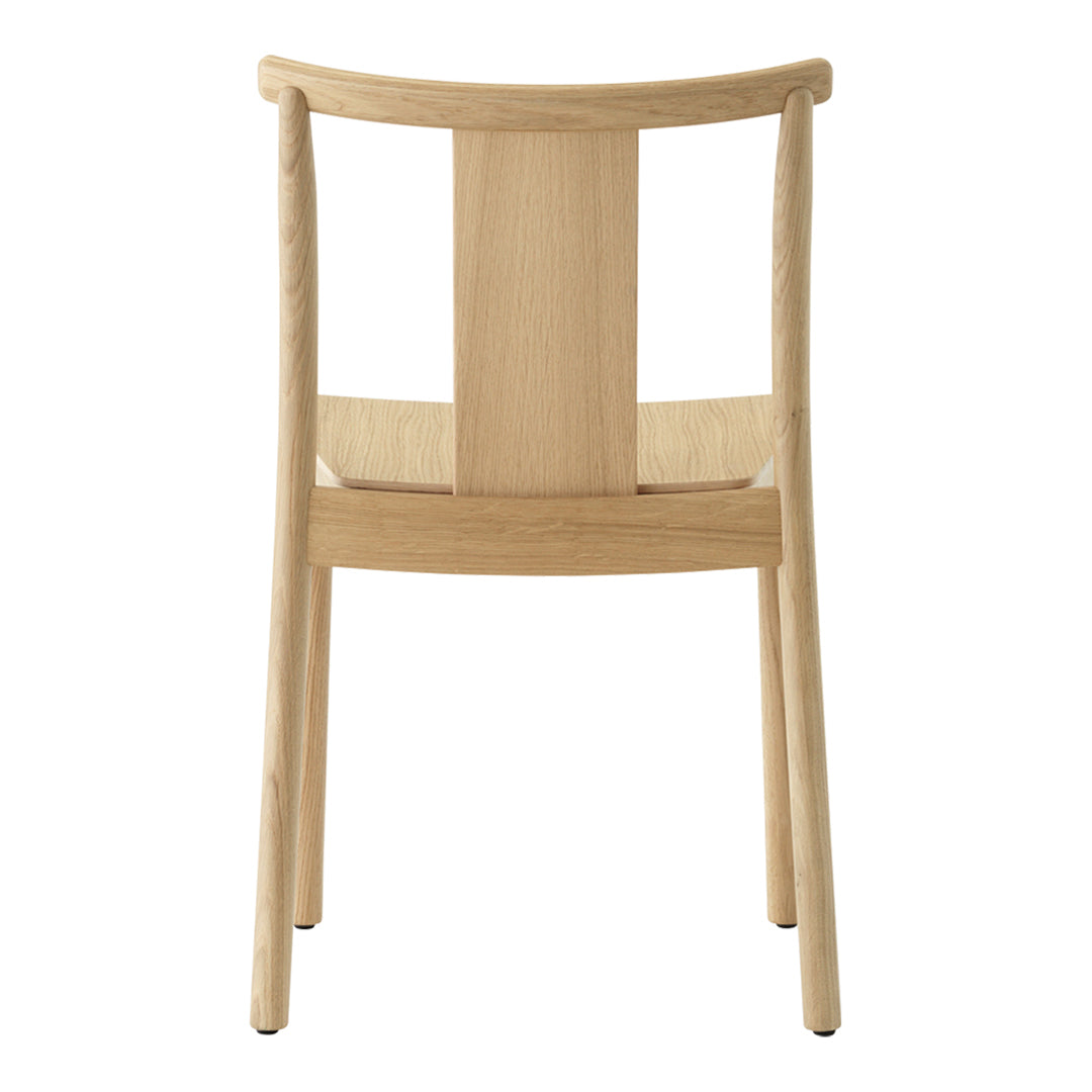 Light natural wood chair with a minimalist design and smooth, clean lines, featuring a simple backrest pattern.