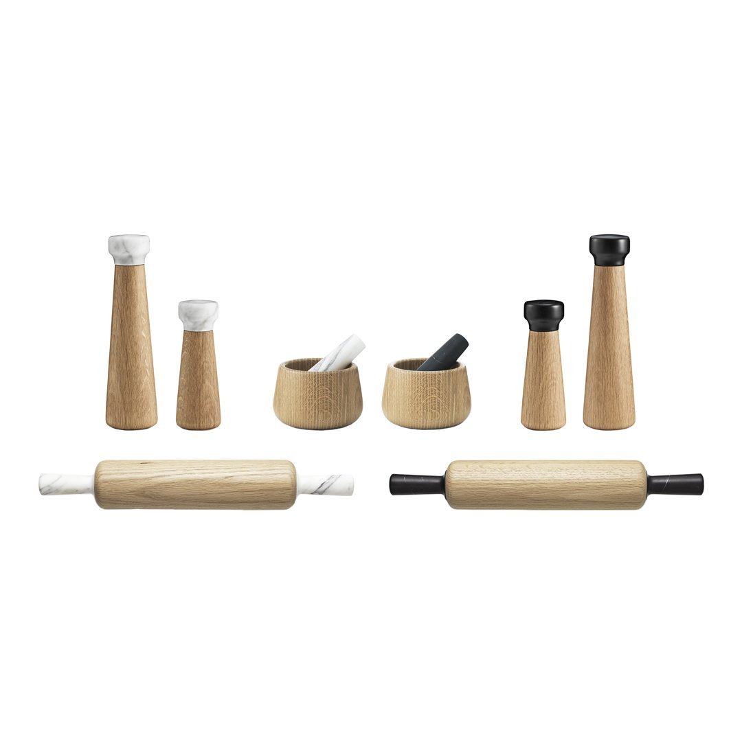 "Natural wood kitchen tools with black and white marble accents, featuring minimalist designs and smooth textures."