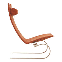 Curved lounge chair in warm, rust orange with a smooth texture and sleek silver base, showcasing modern design.
