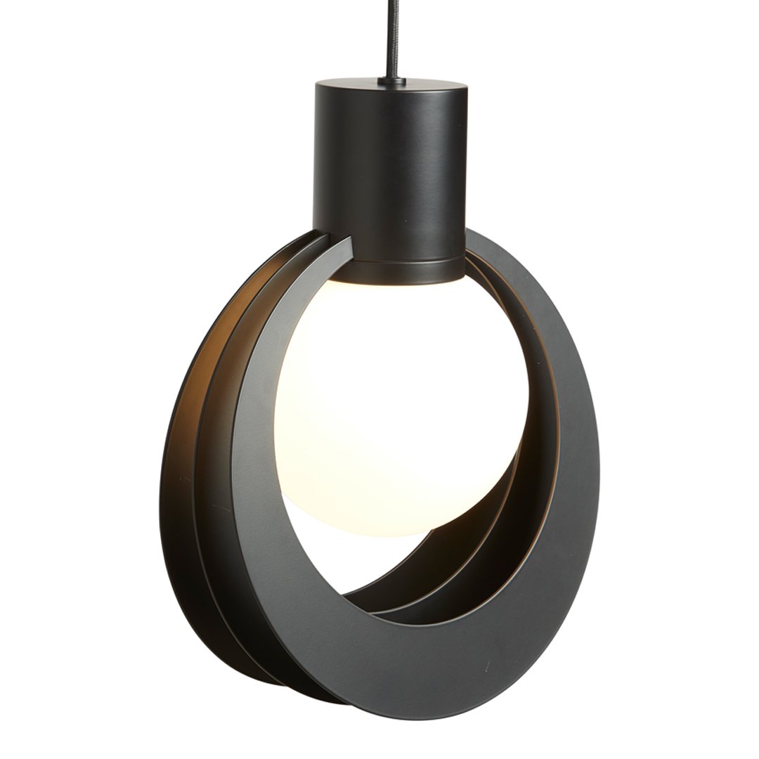 Modern black pendant light with a sleek circular pattern and warm white glow for contemporary decor.