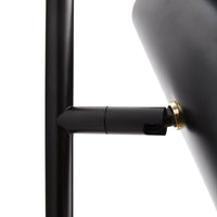 Close-up of a sleek black lamp with a gold accent, showcasing a modern, minimalistic design and smooth finishes.