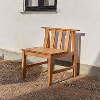 Natural wood bench with a sleek, slatted design in warm, honey tones, perfect for outdoor spaces.