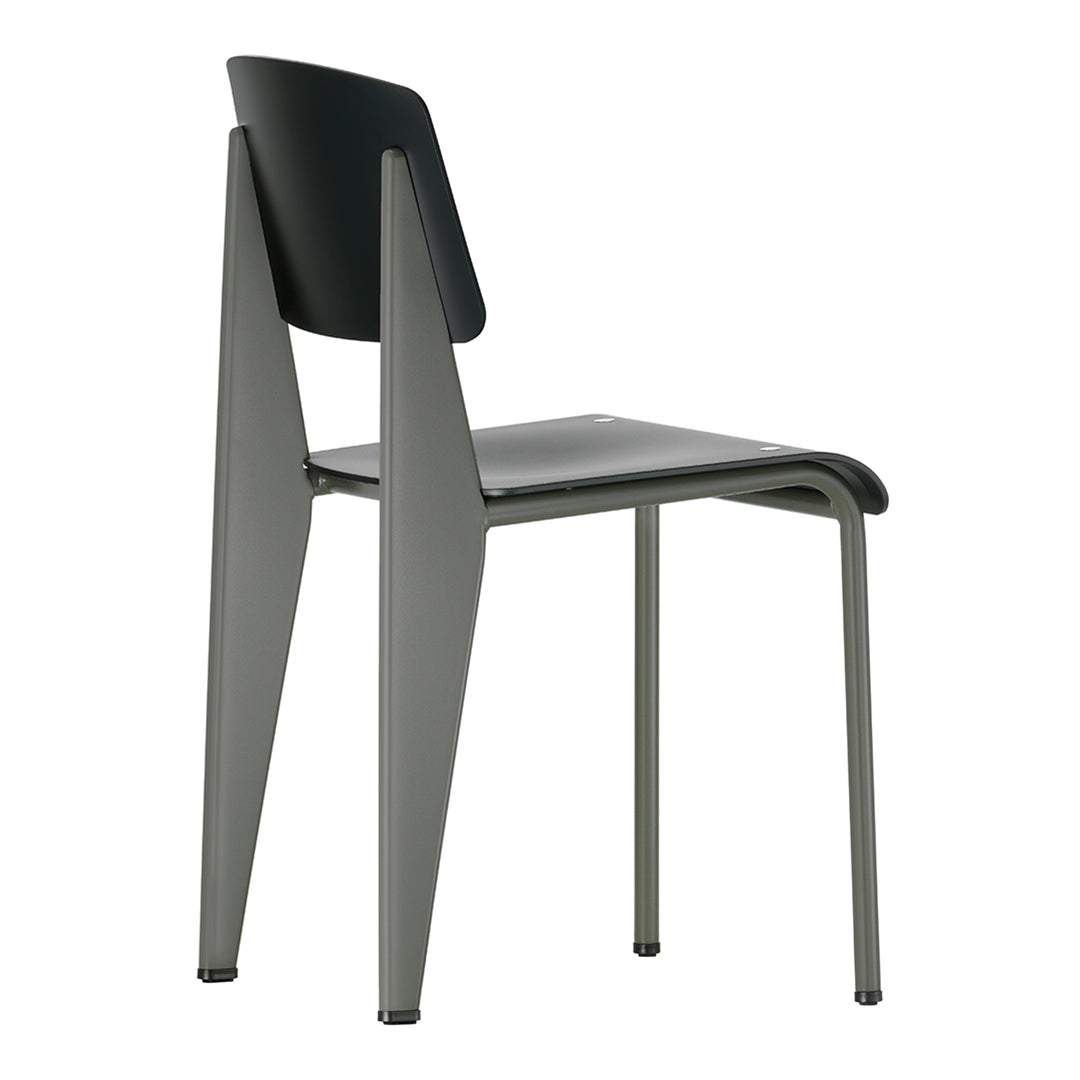 Sleek black and gray chair with minimalist design and smooth surfaces, featuring angular legs for modern appeal.