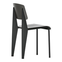 Stylish black chair with sleek lines and minimalist design, perfect for modern interiors.