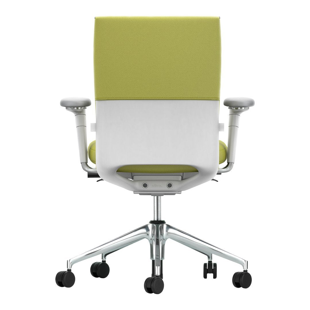 Back view of an ergonomic office chair featuring a vibrant green and white color scheme.