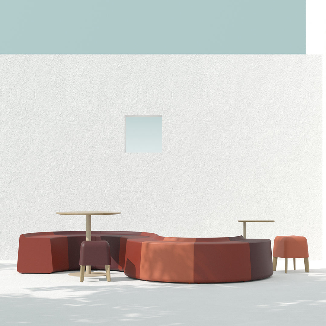 Modern seating in warm terracotta and deep red, complemented by light wooden accents and a soft blue backdrop.