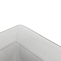 Light gray textured fabric corner detail with subtle stitching patterns, perfect for modern decor.