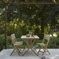 Wooden outdoor dining set with a natural finish, featuring a slatted pattern and a warm, rustic aesthetic.