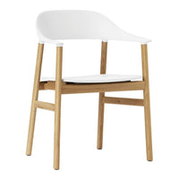 Modern white chair with a minimalist design and natural wood legs, perfect for any contemporary space.