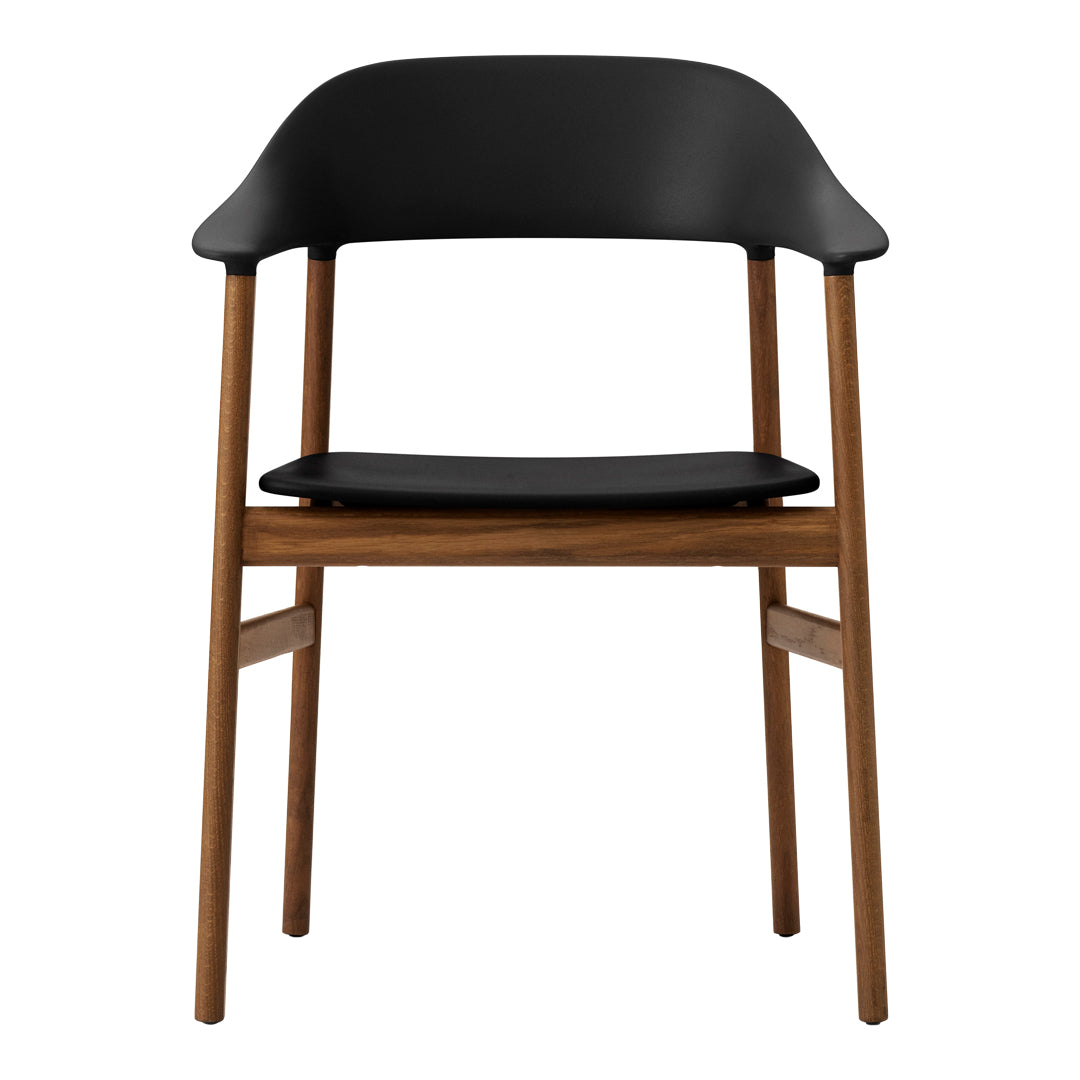 Modern chair featuring a sleek black seat and backrest with natural wood legs for a stylish contrast.
