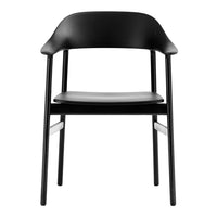 Sleek black chair with a minimalist design and smooth matte finish, perfect for any modern space.