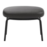 Black padded stool with a smooth, rounded top and slender metal legs. Minimalist design, perfect for modern decor.