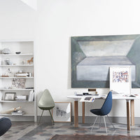 Modern workspace featuring muted green and blue tones, geometric patterns, and a minimalist aesthetic.