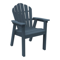 Dark blue Adirondack chair with classic slatted design and wide armrests, perfect for outdoor relaxation.
