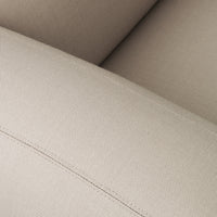 Beige upholstery with a subtle texture and stitched detail, ideal for modern home decor.
