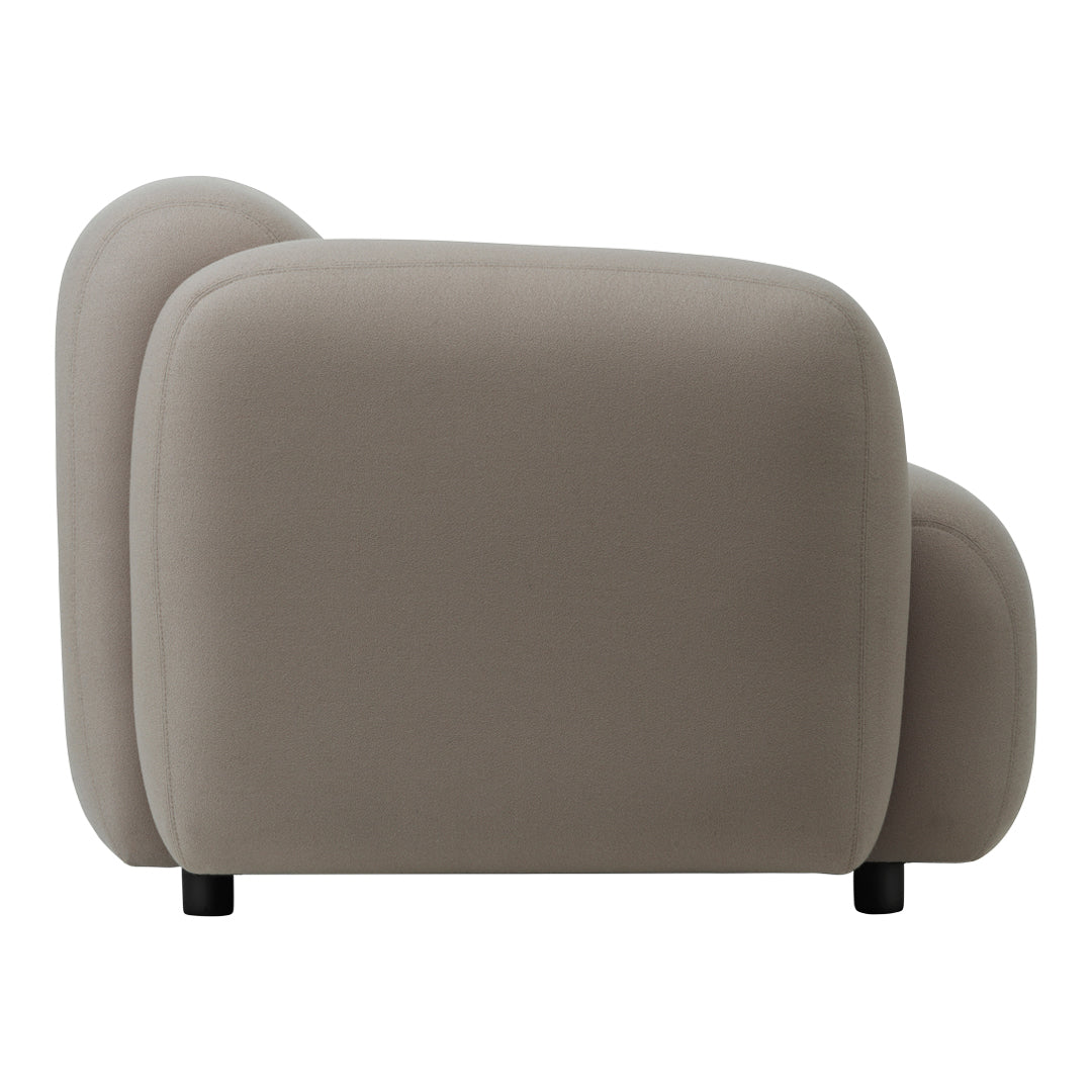 Light taupe plush sofa with rounded edges and a smooth, minimalist design. Ideal for modern decor.