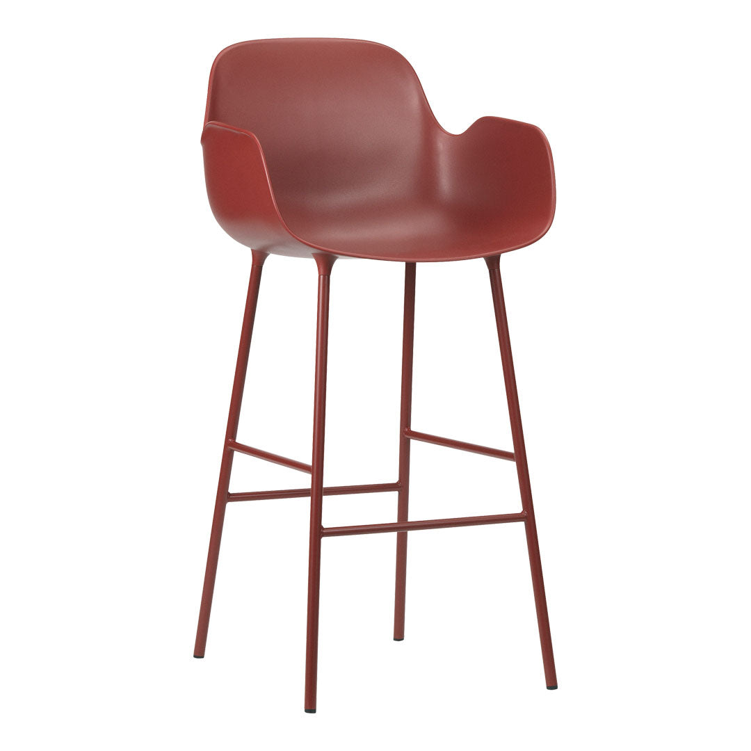 Red plastic bar stool with minimalist design and metal legs. Clean lines and modern aesthetic for any space.