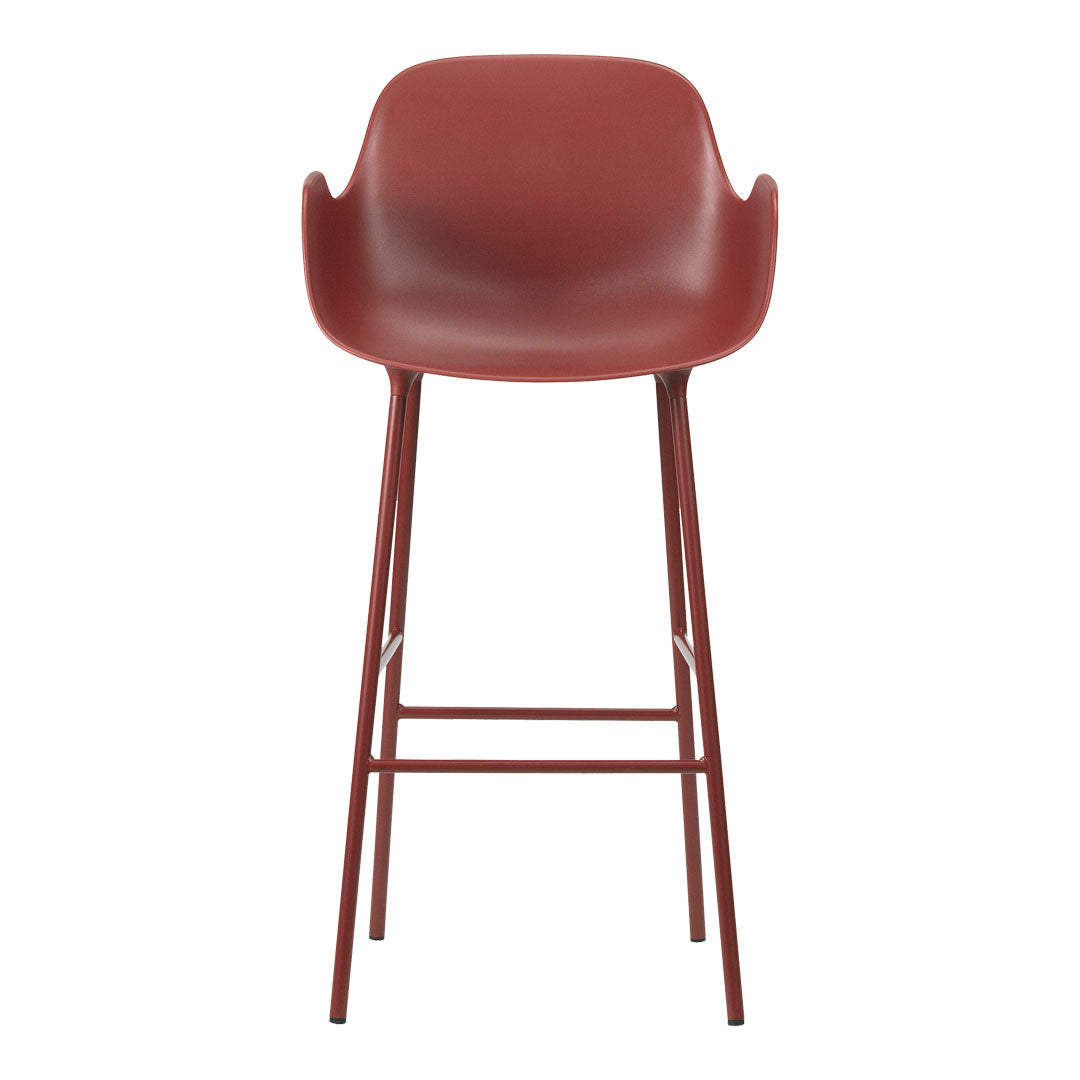 Rust red modern bar stool with a sleek, curved seat and minimalistic metal legs. Ideal for contemporary spaces.