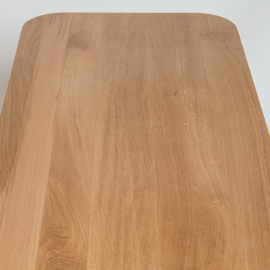 Natural wood tabletop with a smooth, light brown finish and subtle grain patterns. Perfect for modern decor.