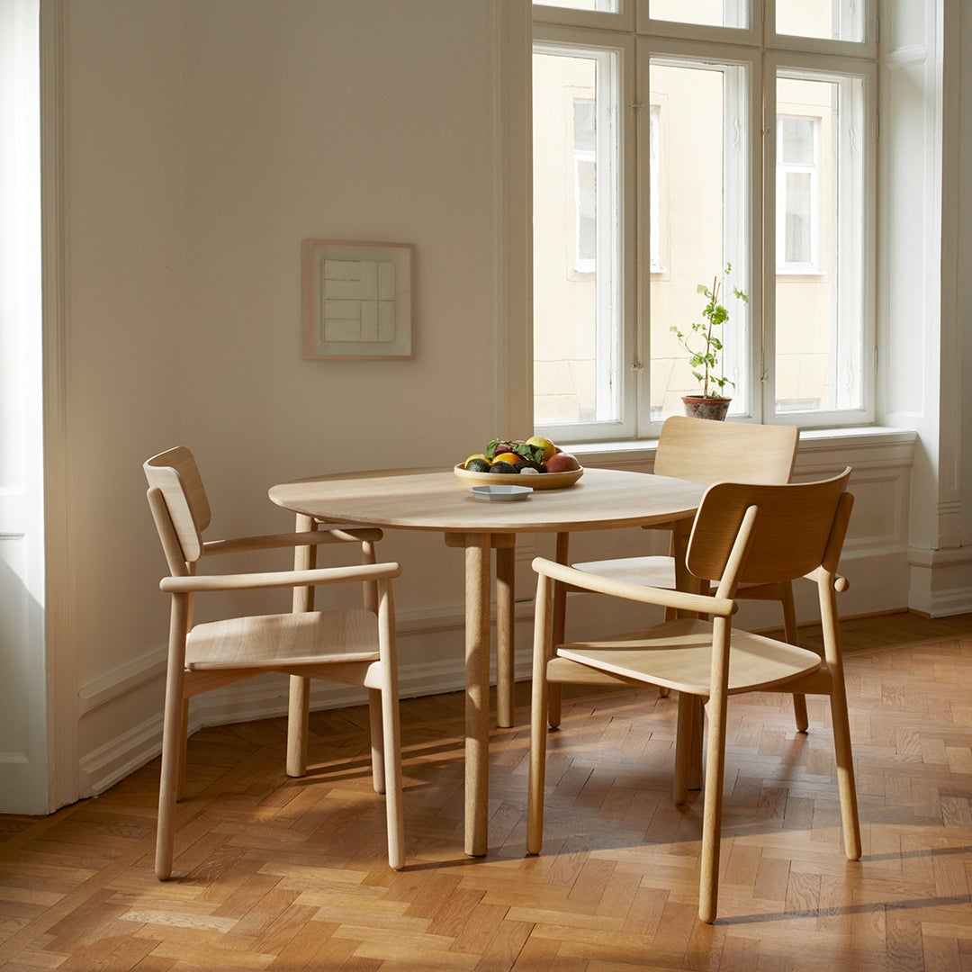 Light oak dining table set with natural wood finish, simple design, and warm tones. Ideal for modern interiors.