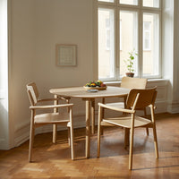 Light oak dining table set with natural wood finish, simple design, and warm tones. Ideal for modern interiors.