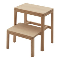 Natural wood step stool with a smooth, light finish and clean, minimalist design. Ideal for various home settings.