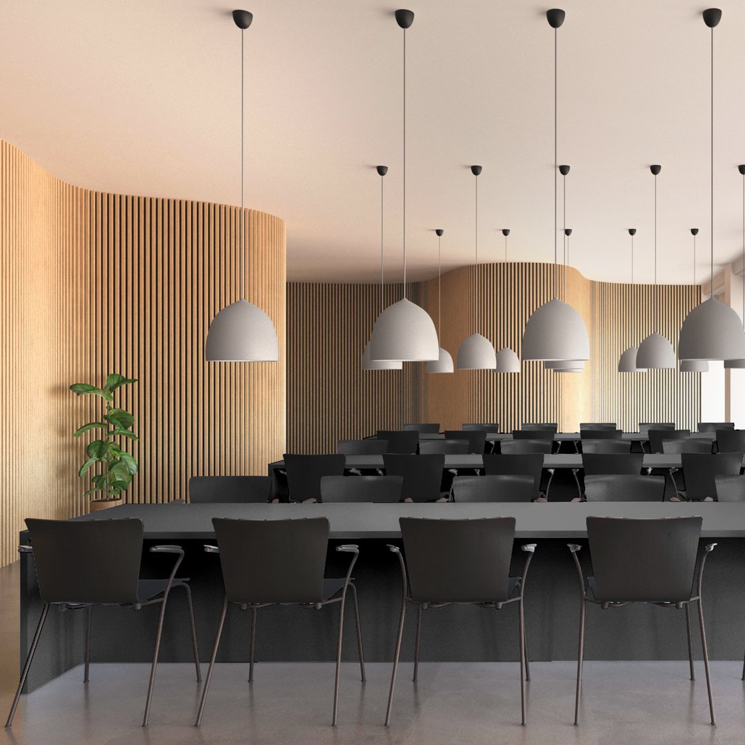 Modern black chairs with smooth lines, accented by warm wood tones and sleek white pendant lights in a minimalist setting.
