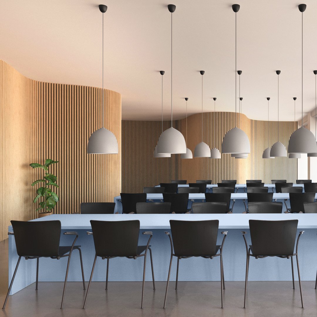 Modern interior with wooden paneling, gray pendant lights, and black chairs against a light blue counter.