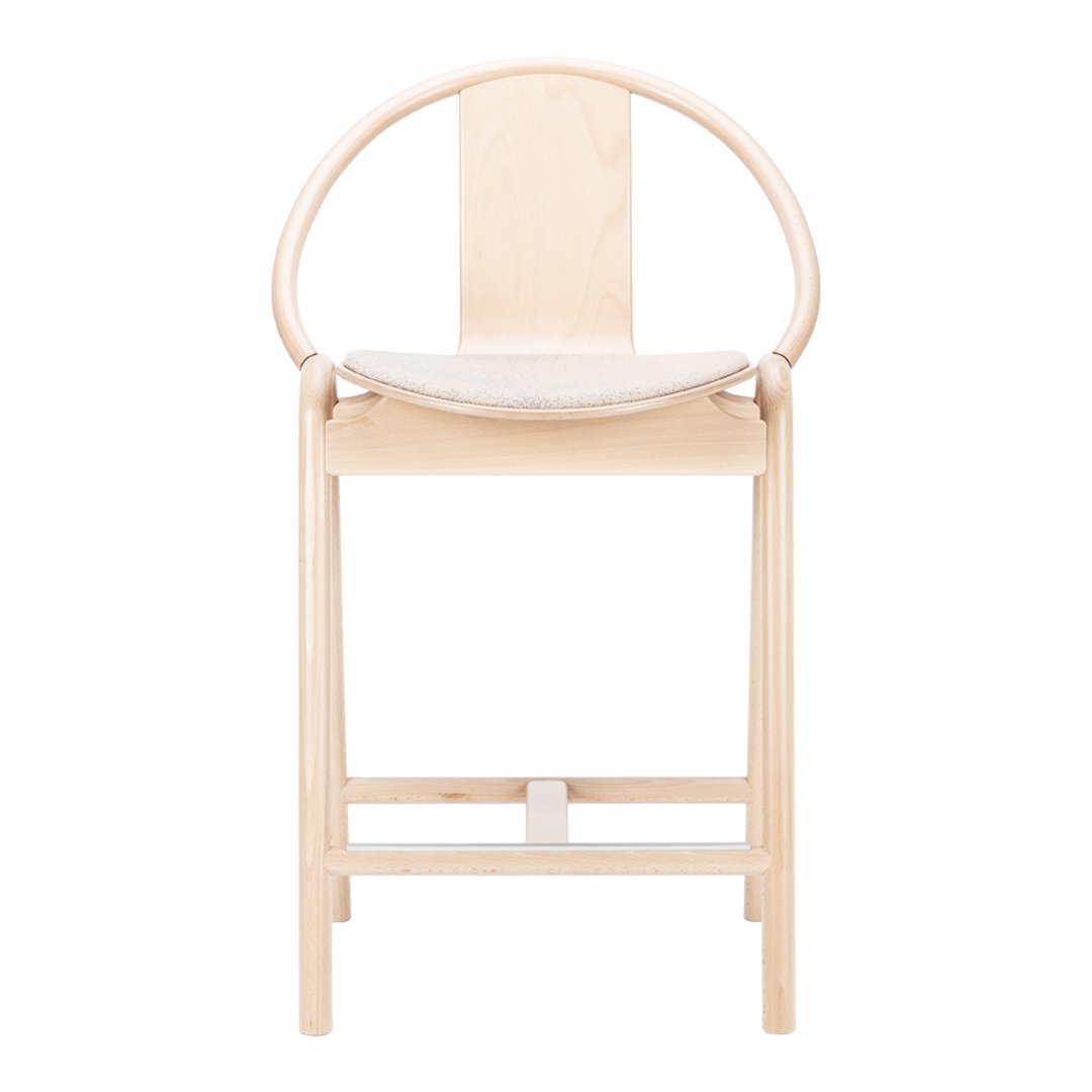 Light natural wood chair with a minimalist design and smooth, curved patterns, ideal for modern interiors.