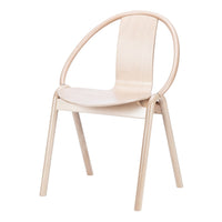 Minimalist light wood chair with smooth, natural grain and an open, circular back design.