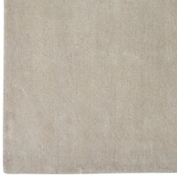 Soft beige rug with a subtle, textured pattern, perfect for adding warmth to any space.