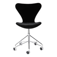 Black velvet chair with a sleek, modern design and chrome base on rolling casters.