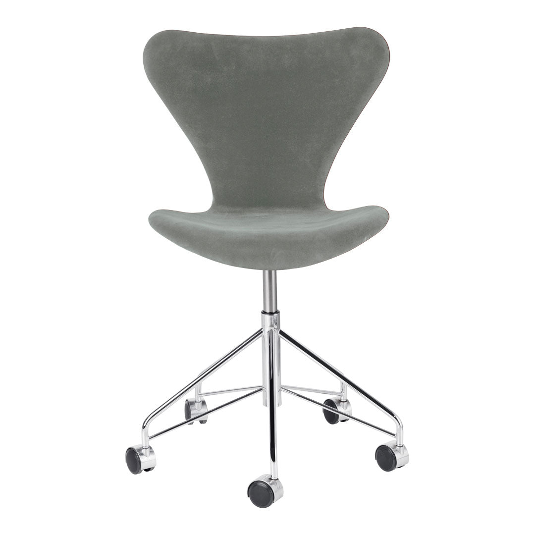 Gray upholstered chair with a smooth texture, supported by a sleek chrome base, featuring wheels for easy mobility.