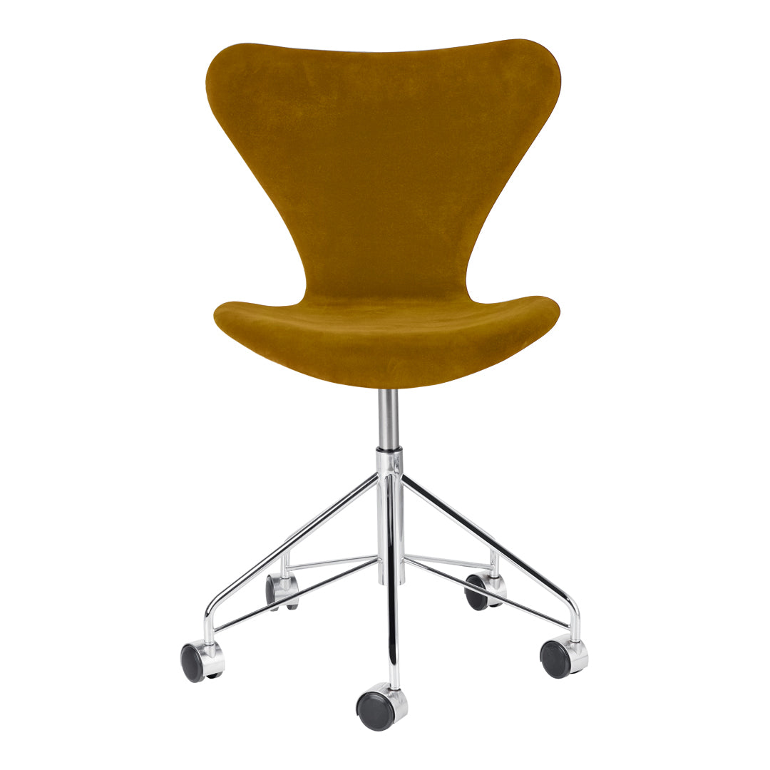 "Velvet mustard yellow chair with a sleek chrome base and rolling wheels, perfect for modern office decor."