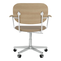 "Modern office chair with a natural wood finish and soft beige upholstery, featuring sleek chrome accents."