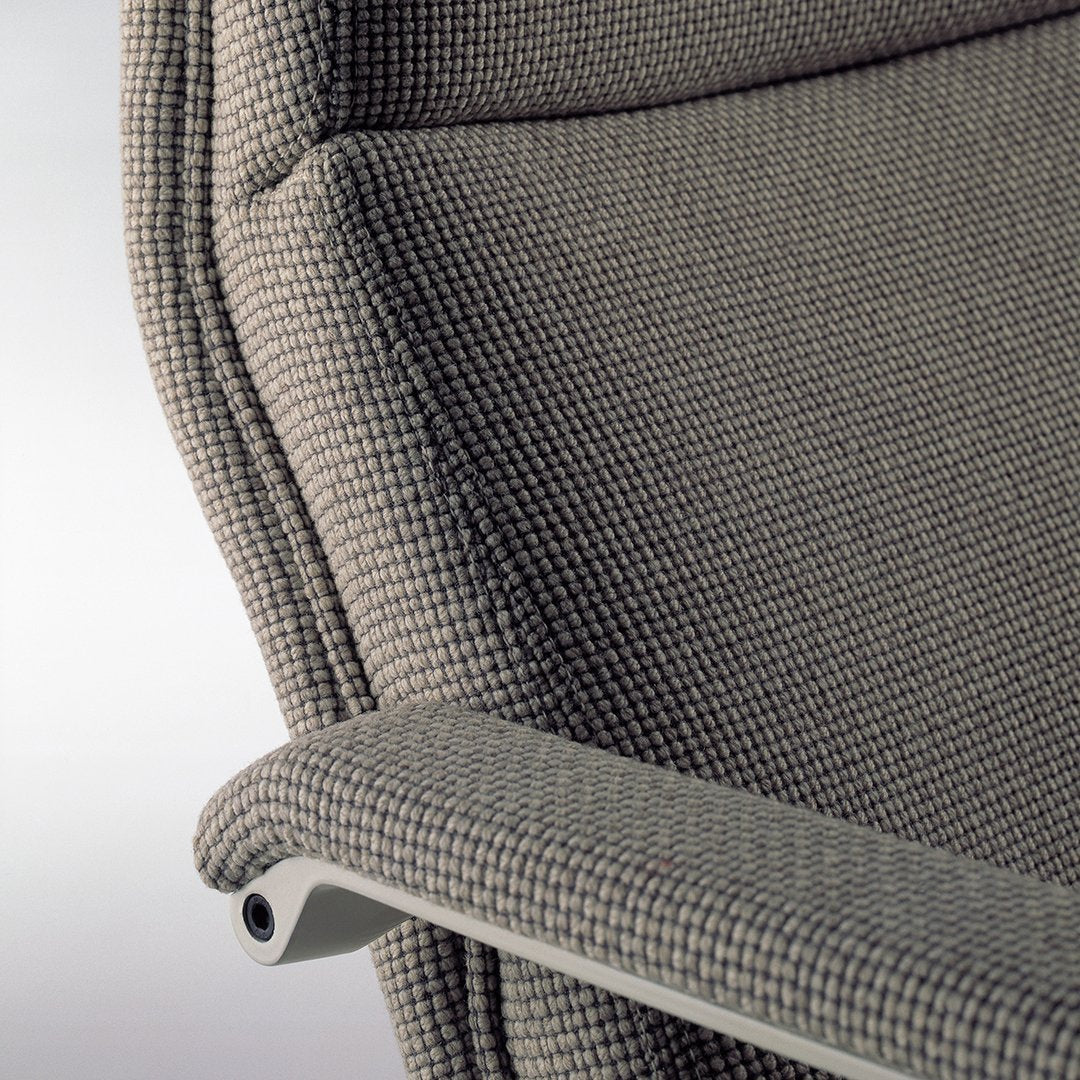 Textured gray fabric with subtle checkered pattern on a modern chair armrest.