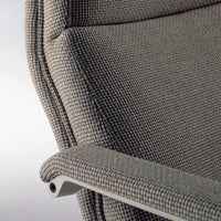 Textured gray fabric with subtle checkered pattern on a modern chair armrest.
