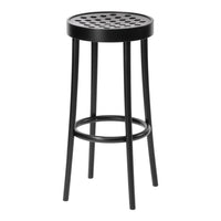 Black bar stool with a round, perforated seat and slender legs, featuring a sleek and modern design.