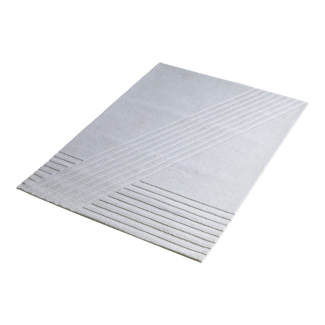 Textured white rug with diagonal and horizontal line patterns, perfect for modern decor.