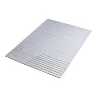 Textured white rug with diagonal and horizontal line patterns, perfect for modern decor.