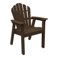 Dark brown Adirondack chair with a slatted back and wide armrests, perfect for outdoor relaxation.