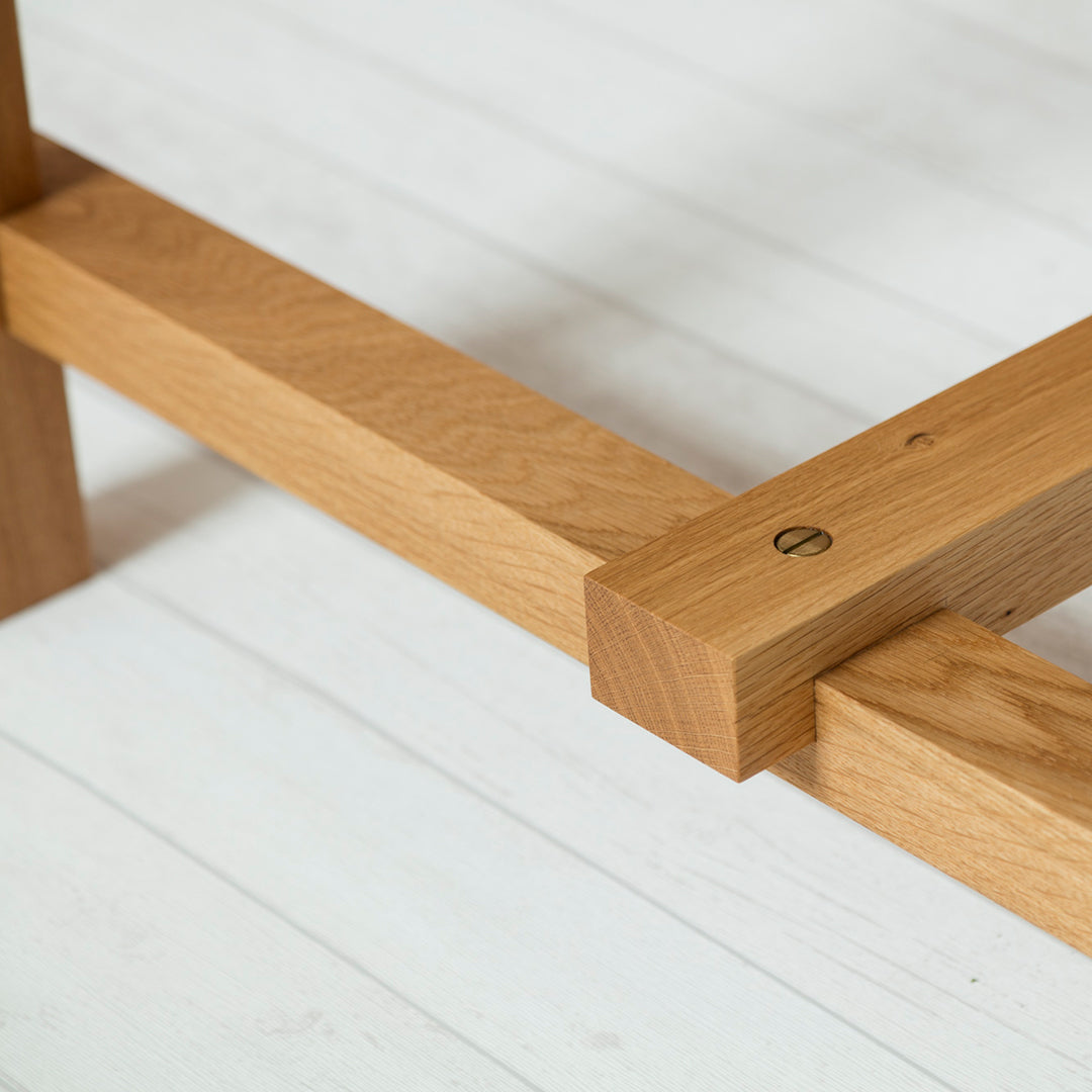 Natural oak wood grain with warm honey tones and smooth finish, showcasing clean lines and minimalist design.