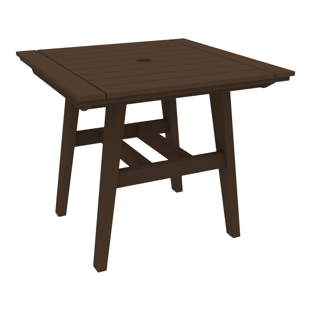 Brown square patio table with a slatted design and an umbrella hole, ideal for outdoor dining.