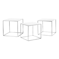 Set of three modern geometric side tables with white tops and silver metal frames, featuring sleek, minimalist design.