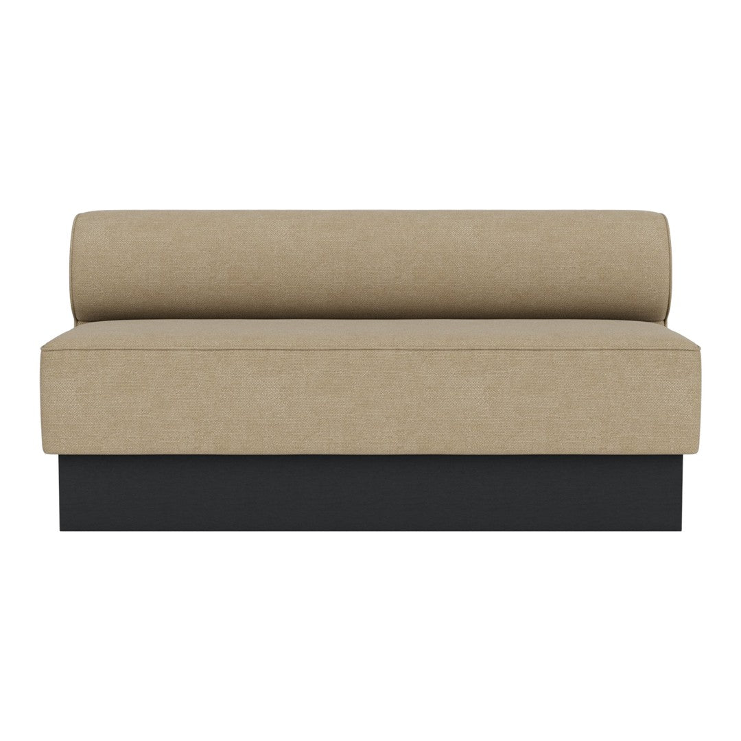 Neutral beige fabric sofa with a rounded back and sleek black base, perfect for modern decor.