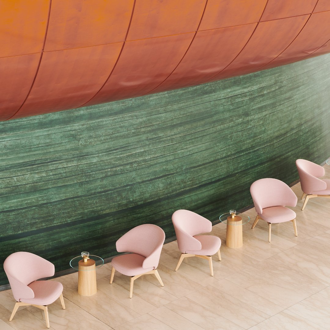 "Pastel pink chairs with wooden legs against a rich green and rust-colored wall, creating a modern, serene ambiance."