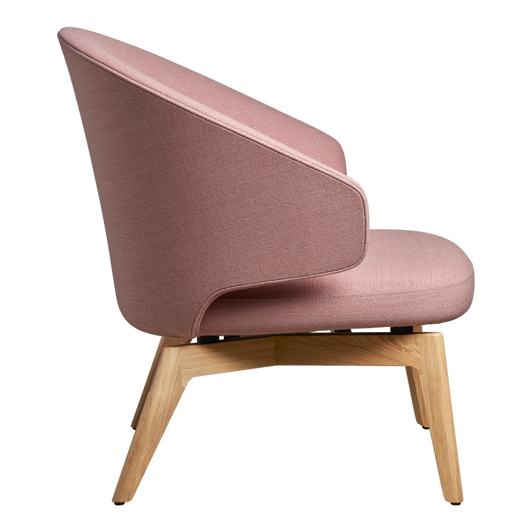 Pink upholstered chair with a smooth texture and natural wood legs, offering a modern and stylish design.