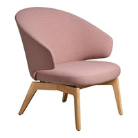 "Soft pink fabric accent chair with smooth curves and natural wood legs."