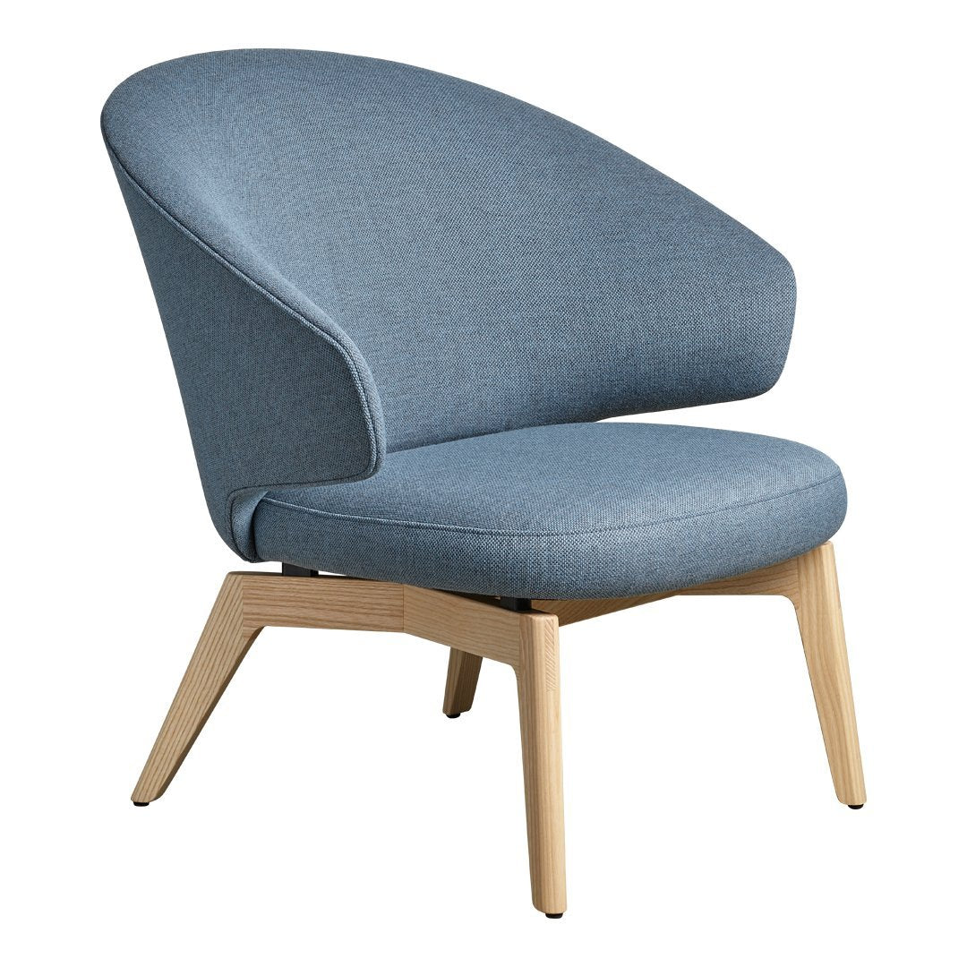 Light blue upholstered chair with a smooth fabric surface and natural wood legs. Modern design with a sleek silhouette.